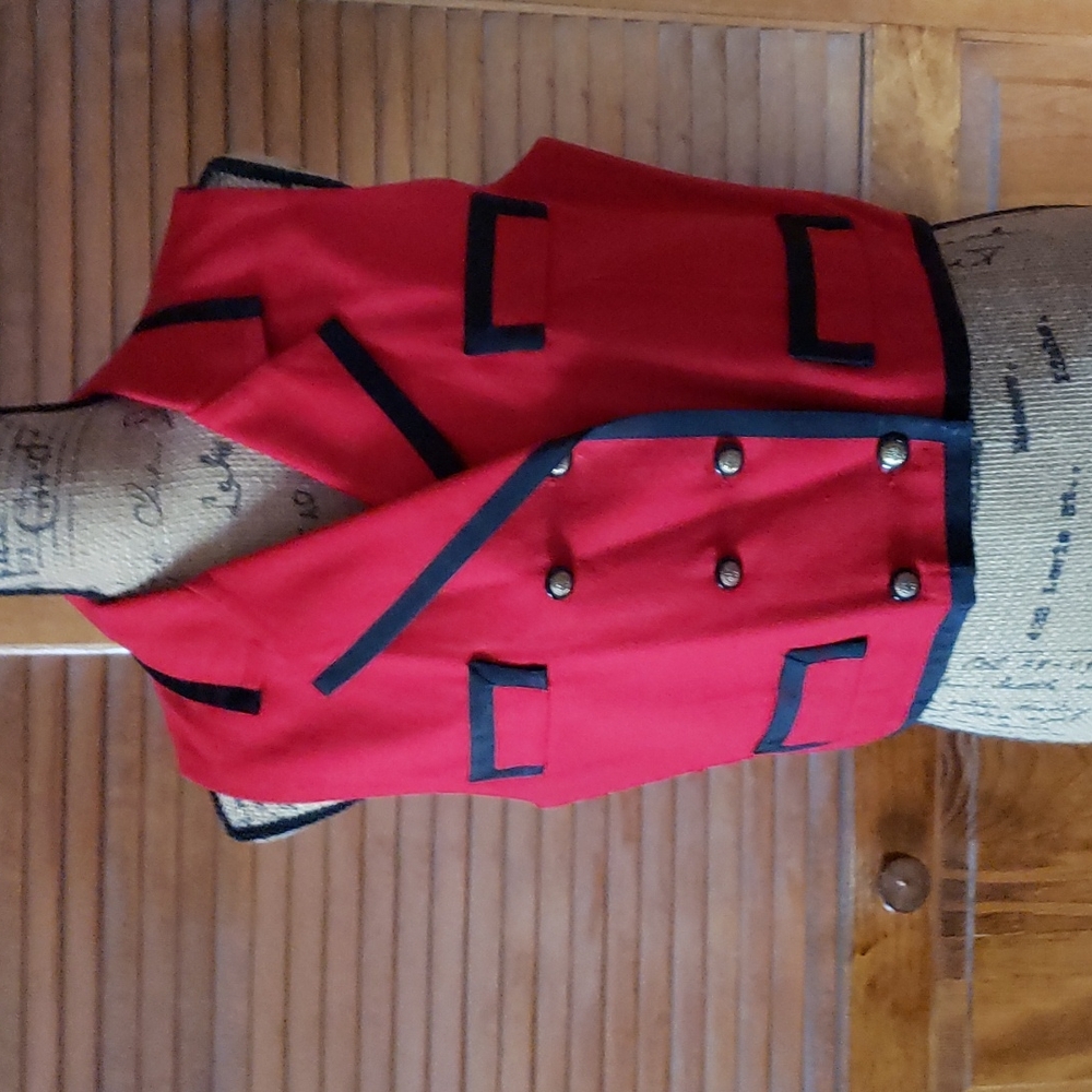 Rich red vest with black lining & detail edges size 12.